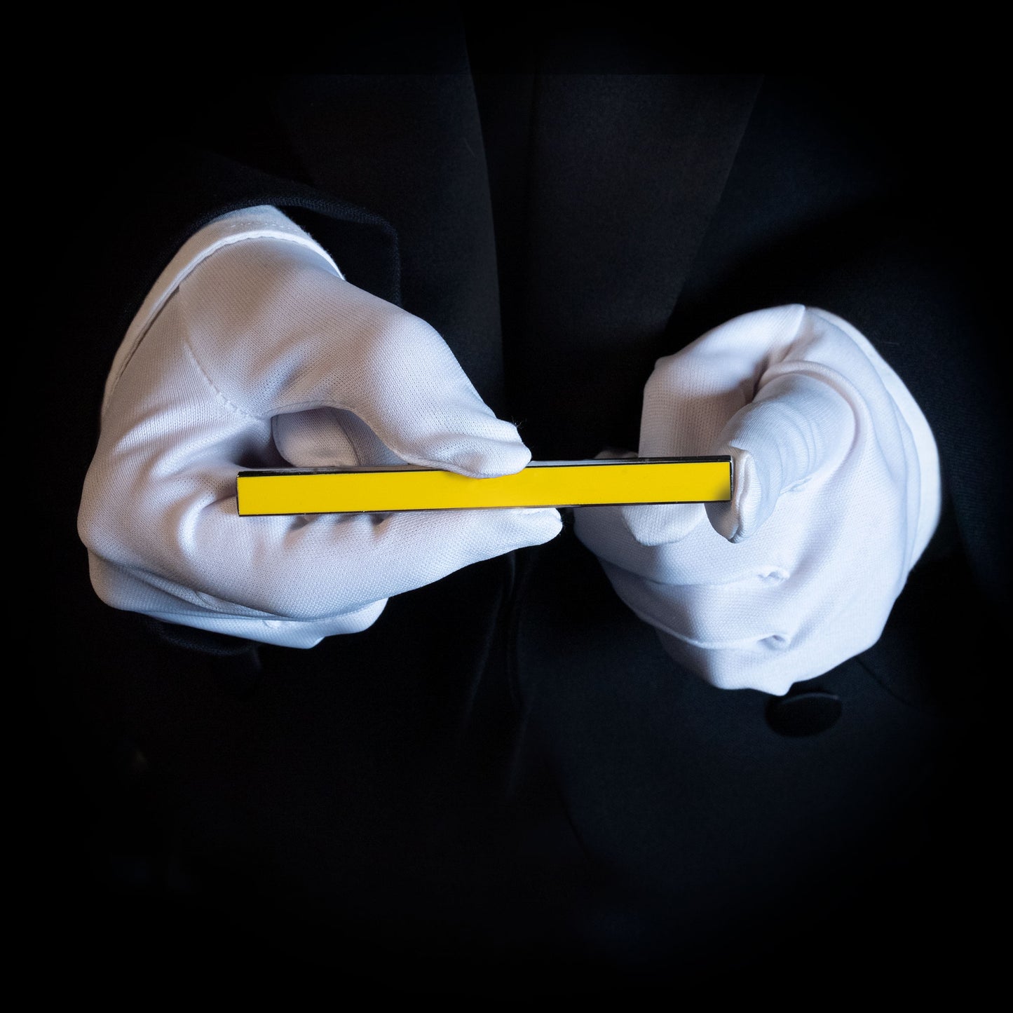 Vibrant yellow Metal Magic Color Stick with a sleek, polished metal and enamel finish, perfect for mesmerizing tricks.