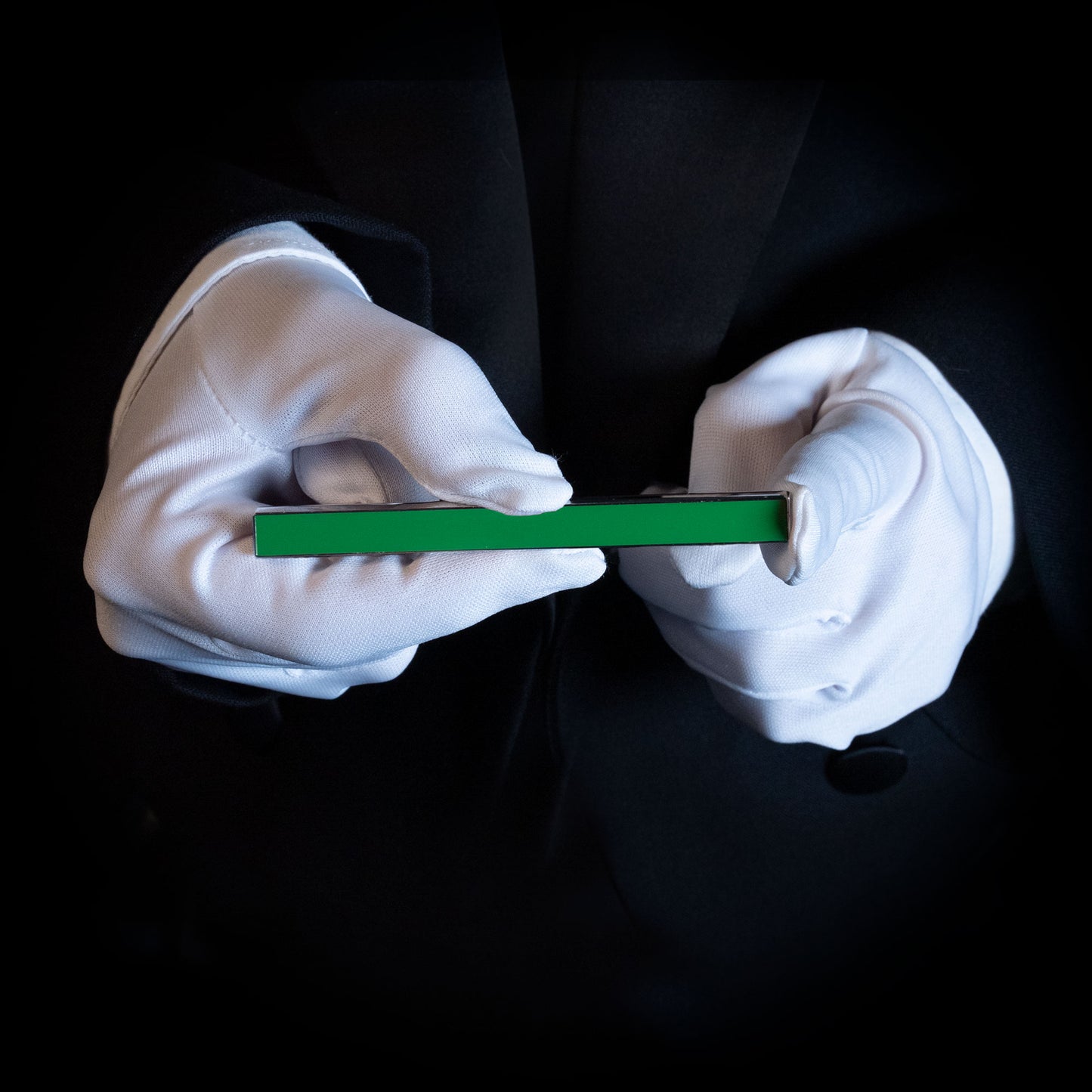 Sleek Metal Magic Color Stick in vibrant Green Force, showcasing a polished metal and enamel finish for stunning visual appeal.