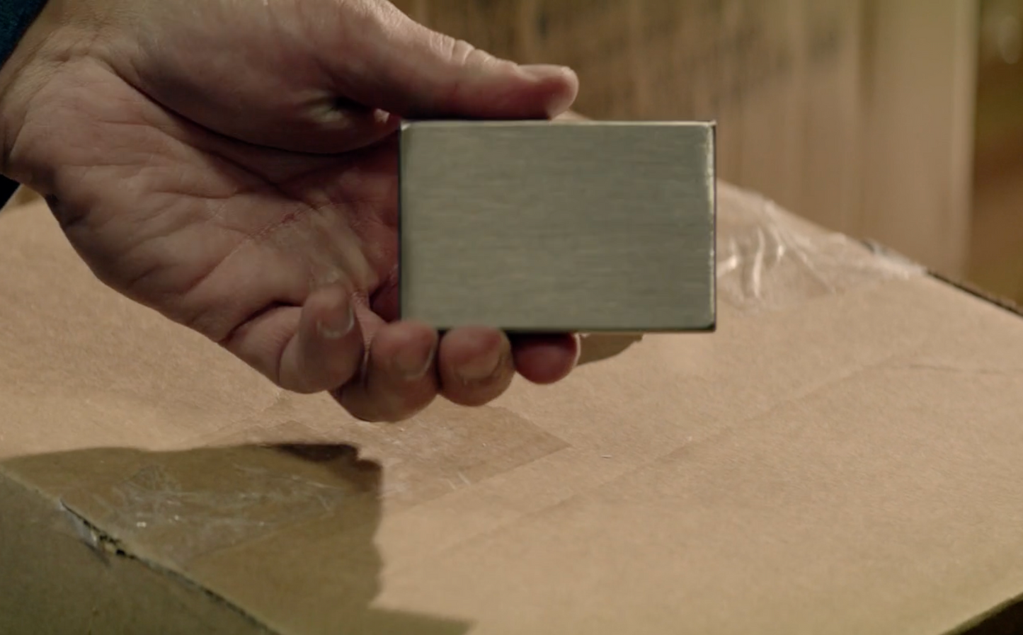 Witness the astonishing Impact Card Deck Penetration Illusion, where a folded card pierces a poker deck, revealing a gleaming steel block inside the card box.