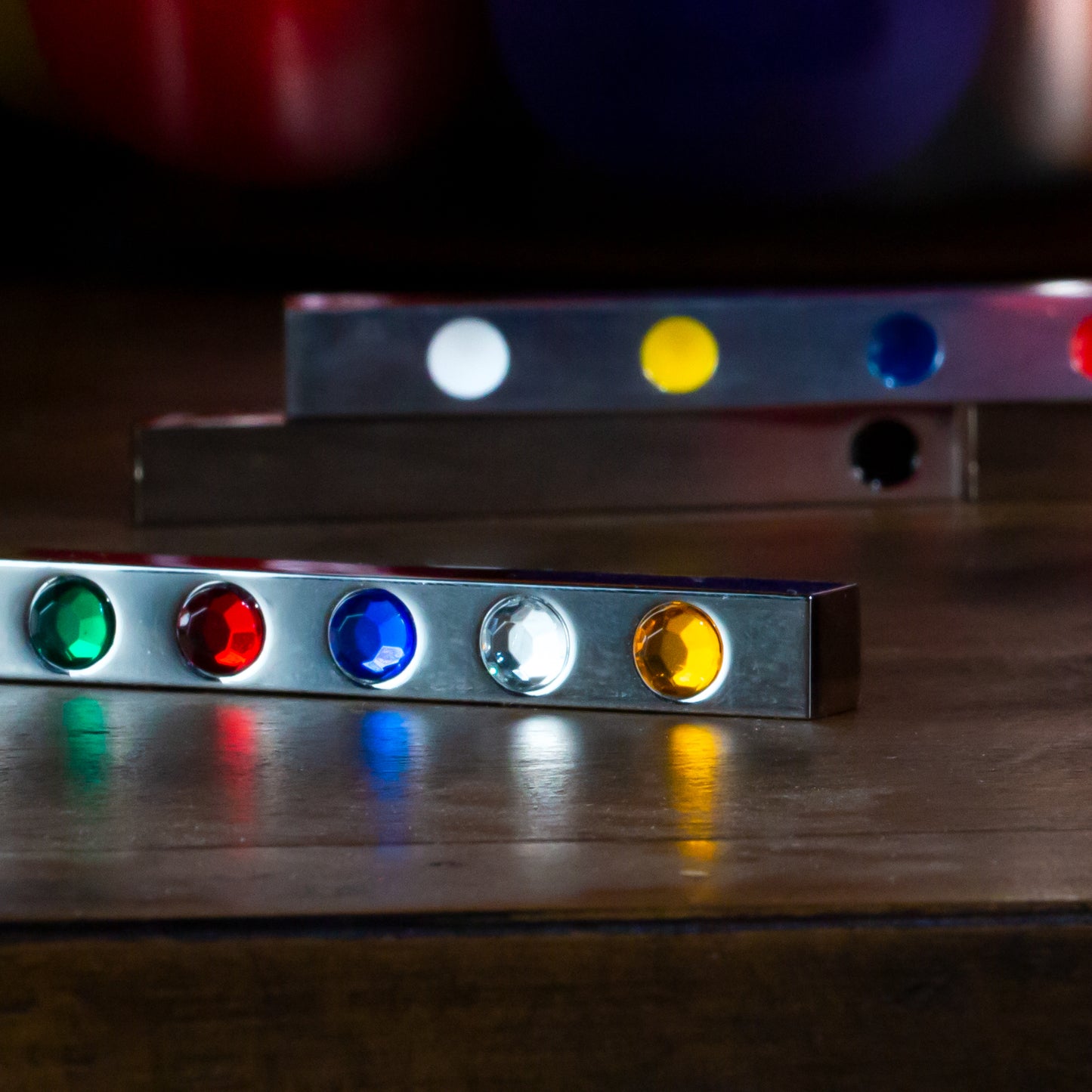 Vibrant Metal Gem Hotrod magic stick with colorful gems, showcasing a sleek design ready to transform with a flick.
