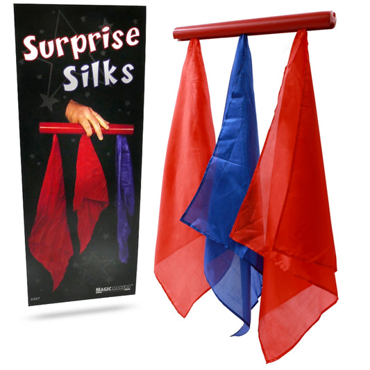 Vibrant blue, red, and yellow silks hang from a wooden rod, showcasing the magical illusion of the Surprise Silks trick.