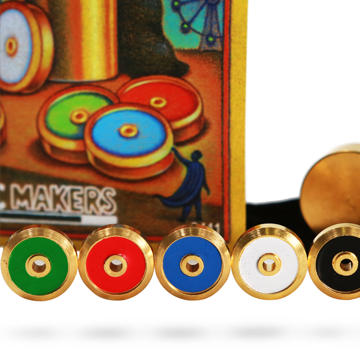 Close-up view of The Super Sight Mind Reading Illusion, featuring a small container and colorful disks for a magical trick.