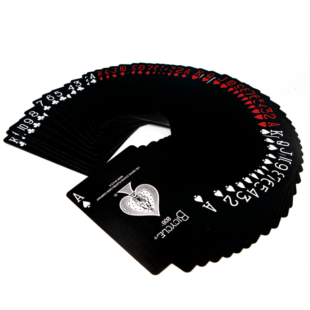 Sleek black Bicycle playing cards deck with vibrant red and white pips on full-color court cards, perfect for magic tricks.