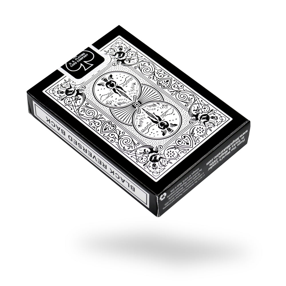 Sleek black Bicycle playing cards deck with vibrant red and white pips on full-color court cards, perfect for magic tricks.