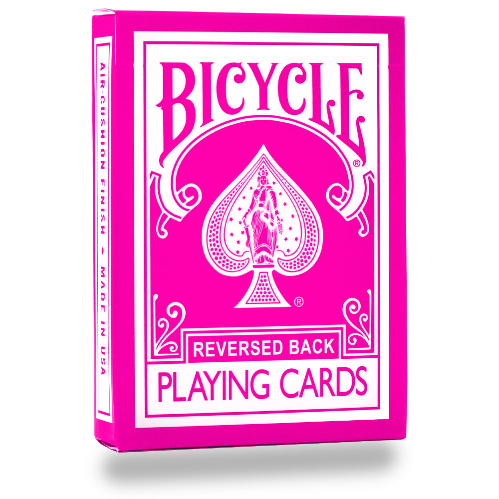 Vibrant hot pink Bicycle Back playing cards with full-color court cards and striking black and white pips on premium stock.