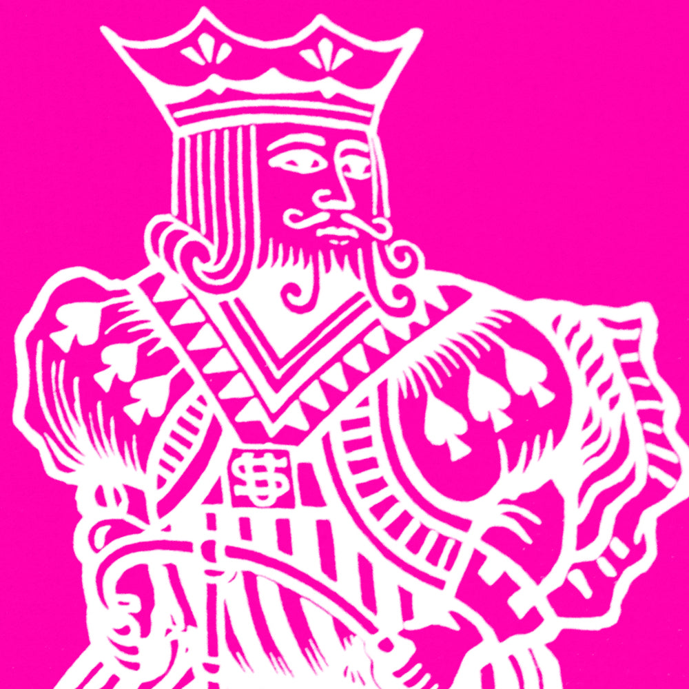 Vibrant pink Bicycle Back playing cards with bold black and white pips on full-color court cards, perfect for card tricks.