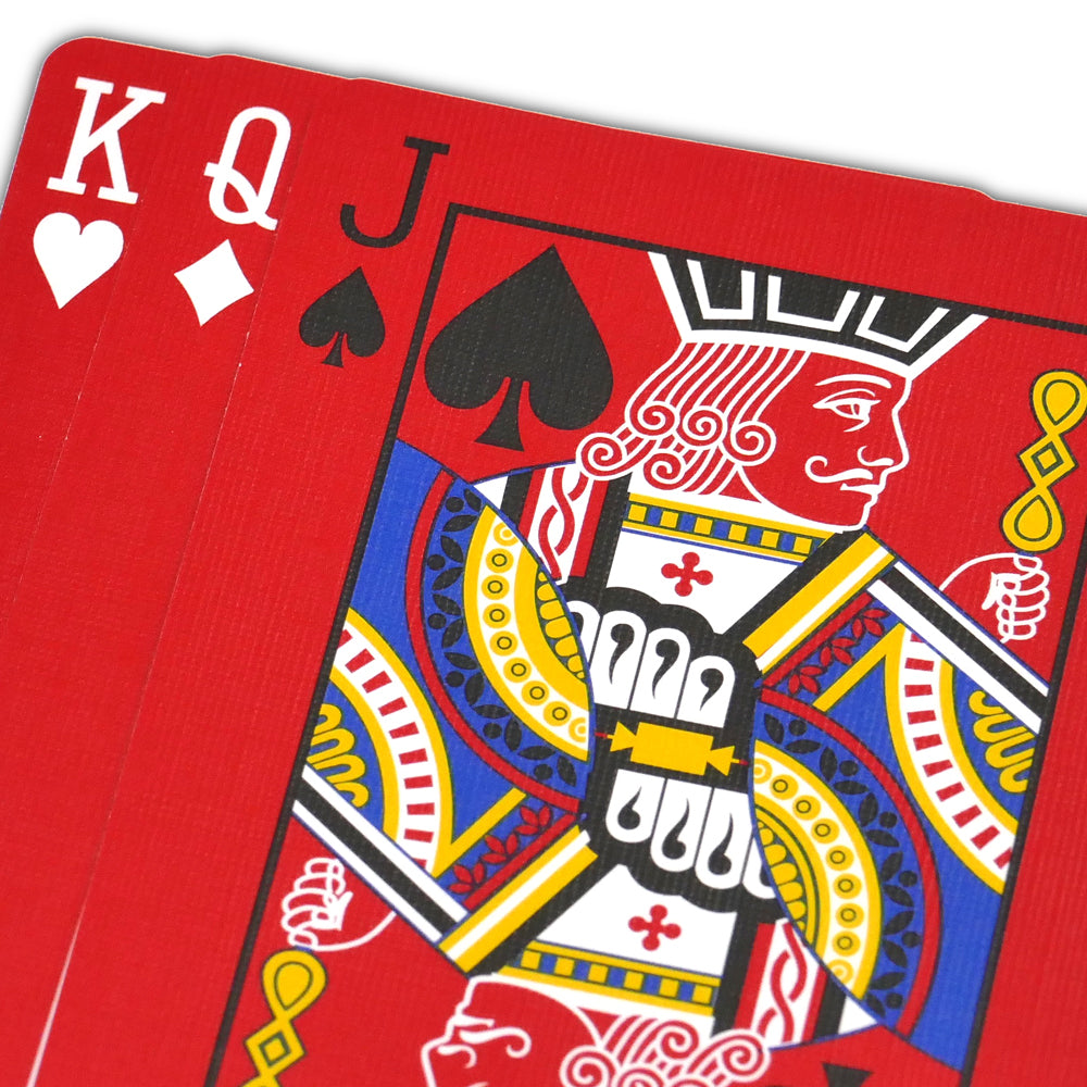 Vibrant red Bicycle Back Playing Cards with bold black and white pips on full-color court cards, perfect for magic tricks.