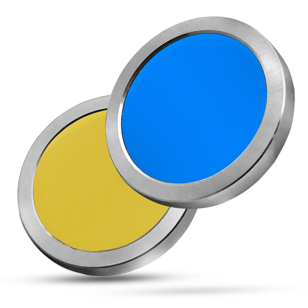 Close-up of Color Deception magic trick with black and white poker chips transforming into vibrant colors on a sleek surface.