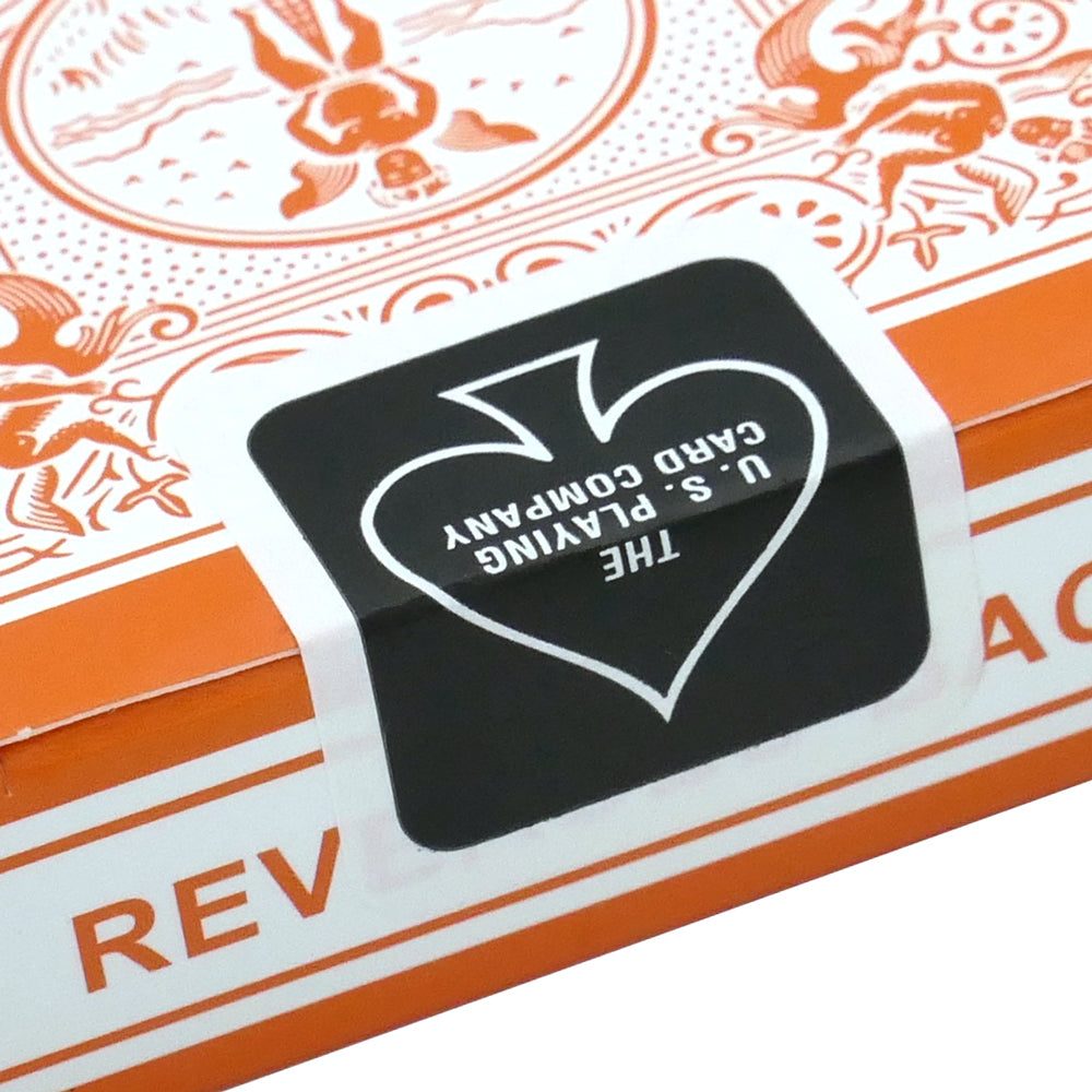 Vibrant orange Bicycle Back playing cards with a striking reversed white design, showcasing a bold and colorful deck.
