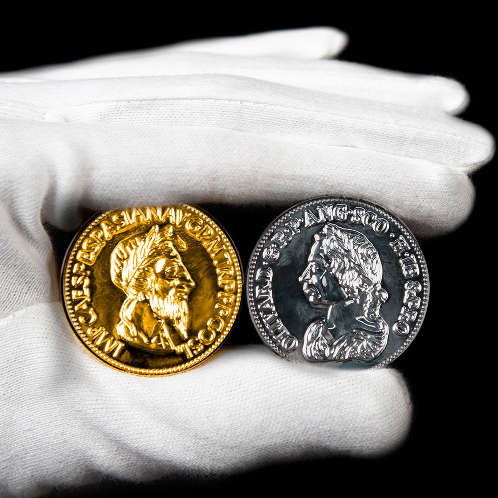 Two shiny gold and silver magic coins resting on a surface, ready to amaze with a vanishing and reappearing trick.