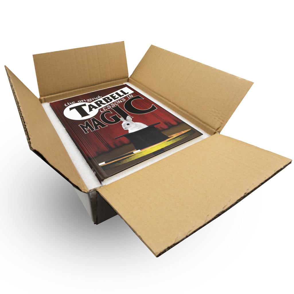 Explore the classic Tarbell Course in Magic book, a thick, hardbound treasure with 900 pages of illustrated magic lessons.