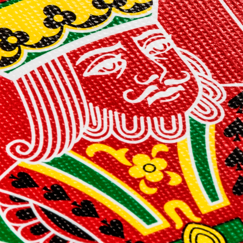 Striking Red Dragon Bicycle playing cards with bold red and yellow designs, featuring full-bleed borders and a unique Dragon Joker.