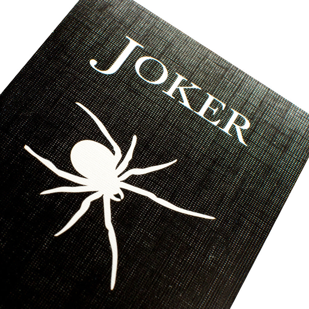 Striking Black Spider Bicycle Back Playing Cards with a bold, full-bleed black design and contrasting white and red pips.