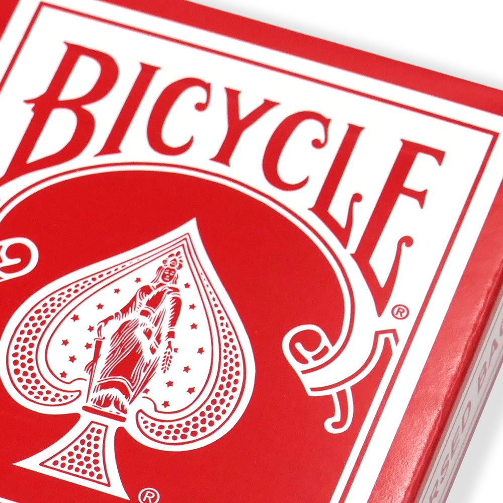 Vibrant red Bicycle Back Playing Cards with bold black and white pips on full-color court cards, perfect for magic tricks.