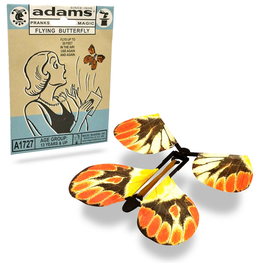 Colorful monarch-patterned butterfly toy springs to life, flying up to 20 feet from a hidden card for a surprising prank.