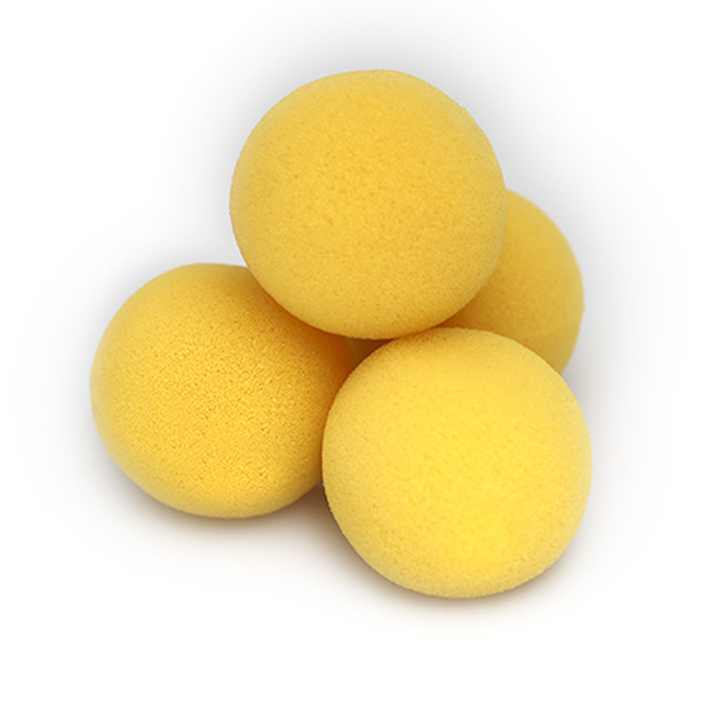 Bright yellow sponge balls with a mysterious, cryptic design, perfect for playful tricks or stress relief.