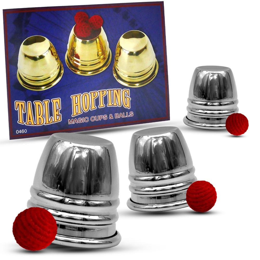 Gleaming set of 3 chrome Table Hopping Cups with 4 red crochet balls and rubber load balls, ready for magic mastery.
