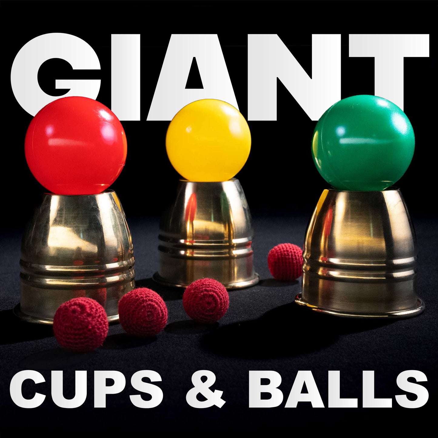 Three giant alloy metal cups with four large crochet knit balls, perfect for a dramatic stage magic cups and balls routine.
