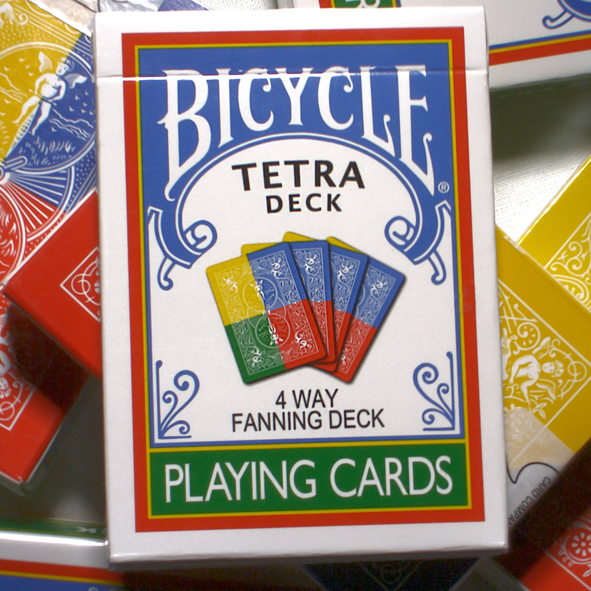 A box of Tetra Bicycle Back Playing Cards, showcasing four fanned cards in blue, green, yellow, and red on the cover with "4 Way Fanning Deck"—a limited edition for any fanning deck enthusiast.