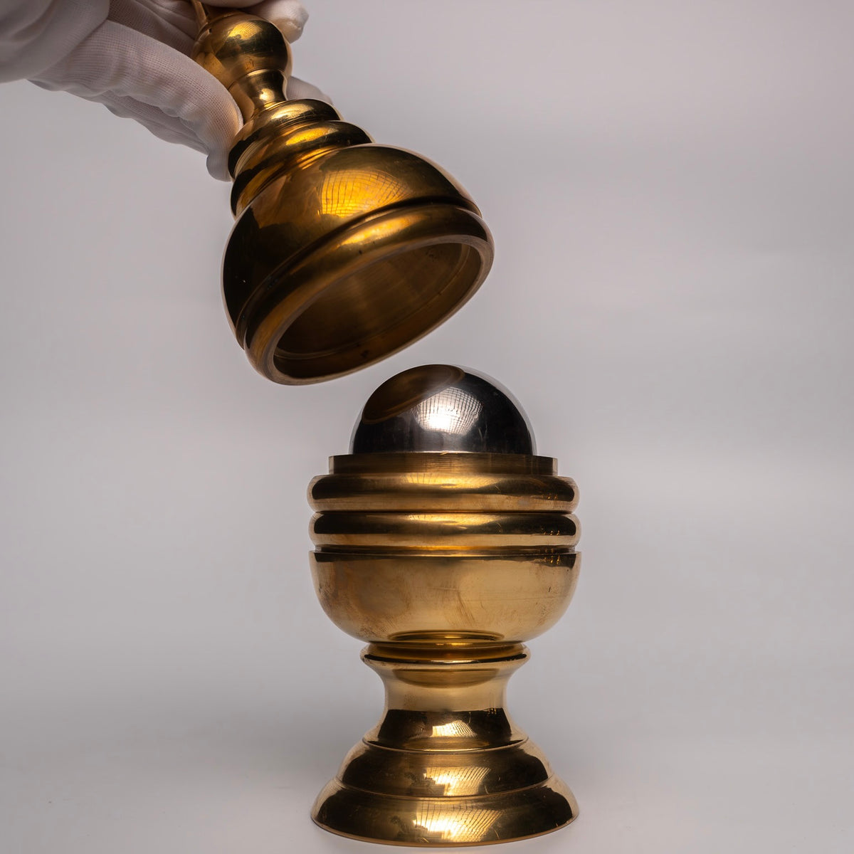 Magic Makers Giant Brass Ball and Vase magic trick, a large-scale premium brass prop for stage performances.