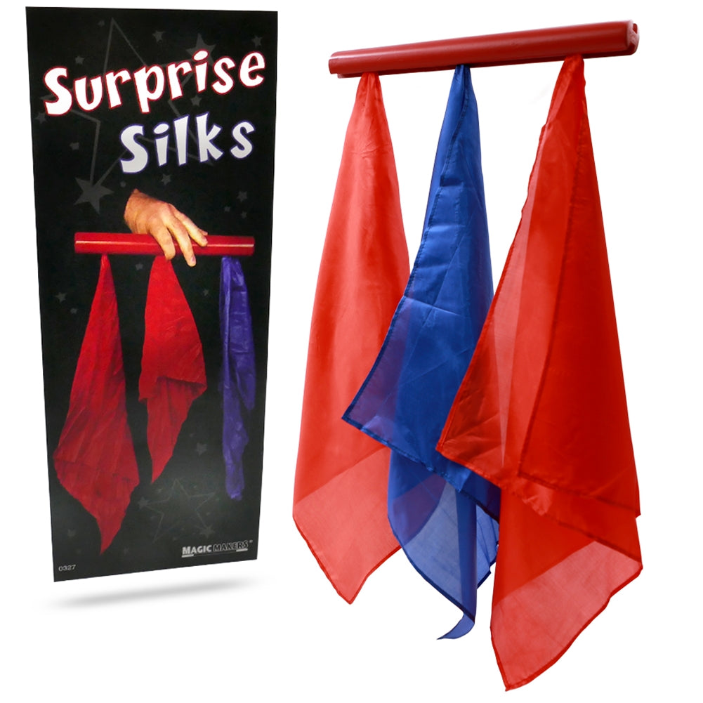 Vibrant blue, red, and yellow silks hang from a wooden rod, showcasing the magical illusion of the Surprise Silks trick.