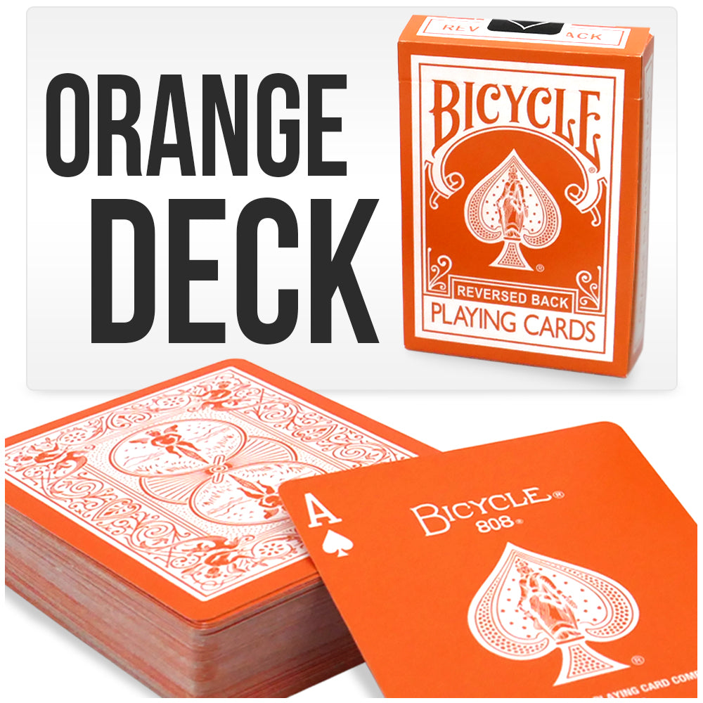 Vibrant orange Bicycle Back playing cards with a striking reversed white design on the back, showcasing bold style.