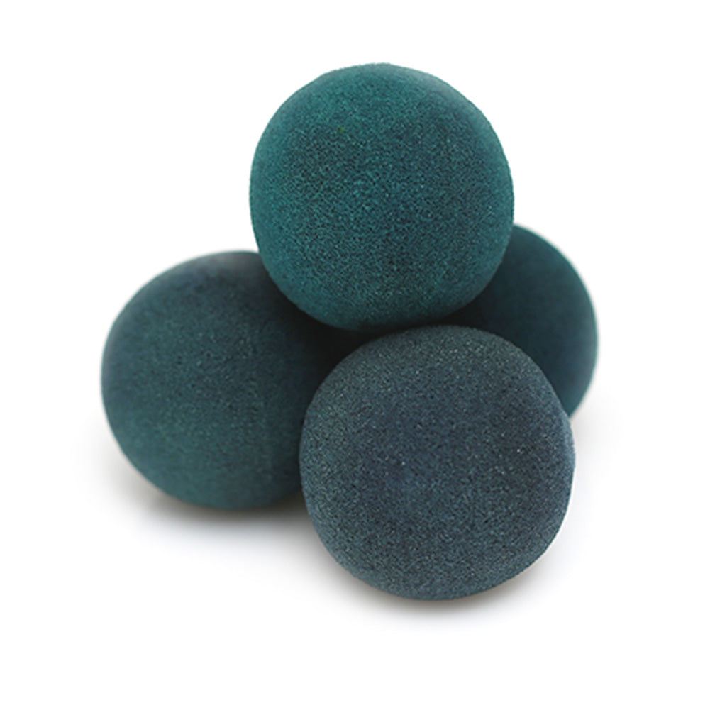 Vintage-style green sponge balls with a distressed finish, showcasing a soft, grippy texture in a set of four, 2-inch diameter balls.