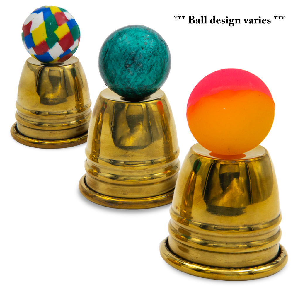 Gleaming set of Gold Table Hopping Cups & Balls with shiny chrome cups and vibrant red crochet balls for magic tricks.